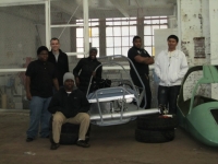 Team members and EVLC in new space