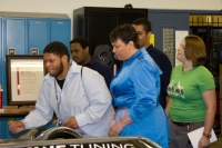 Auto Academy Alumnus Lawrence Jones-Mahoney explains the K-1 Attack to Secretary Jackson